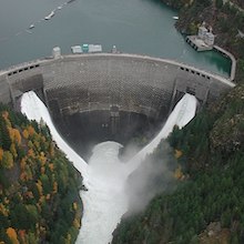 aerial photo of a large, curved dam