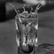 water splashing into a glass