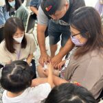 Parents and their child learning about health